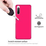 the back of a pink phone case with a hand holding a key