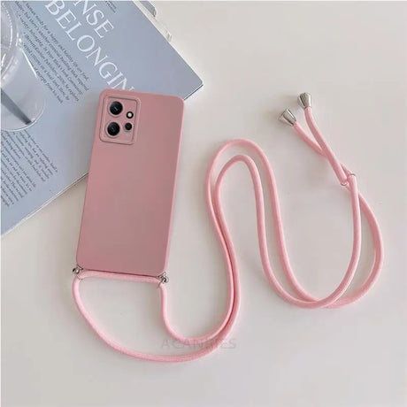 There is a pink phone case with a lanyard attached to it