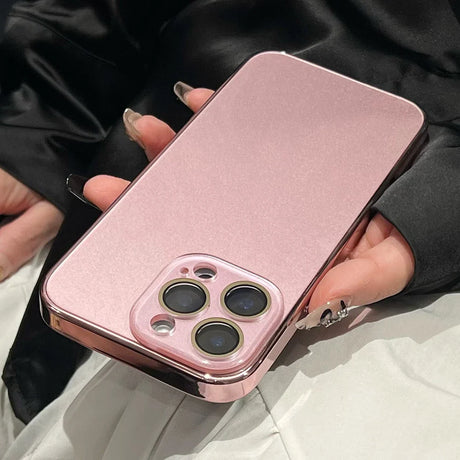 Pink phone case with a raised camera lens protector.