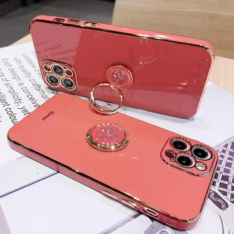 a pink phone case with a ring on it