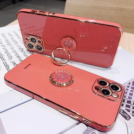 a pink phone case with a ring on it