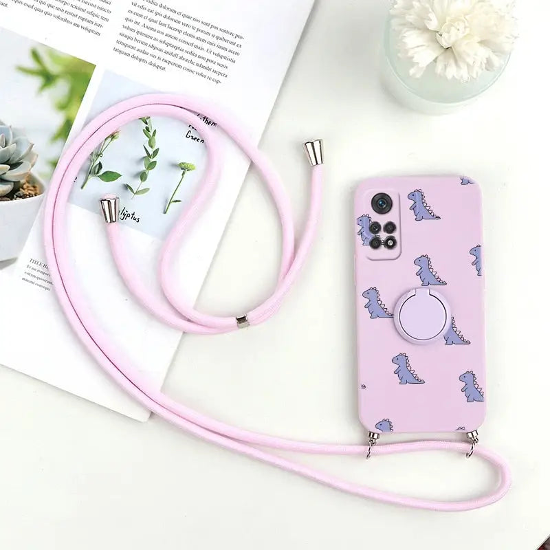 there is a pink phone case with a camera strap on it