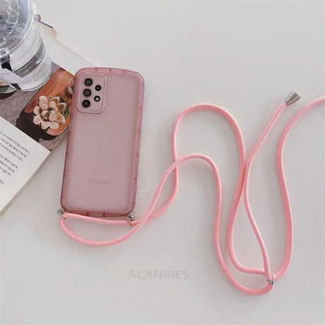 a pink phone case with a pink strap