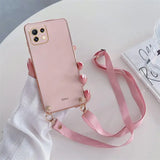 a pink phone case with a pink strap