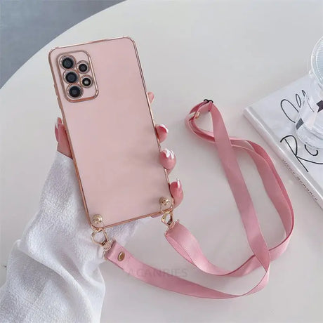 a pink phone case with a pink strap