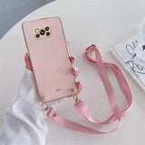 a pink phone case with a pink strap