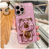 a pink phone case with a teddy bear on it