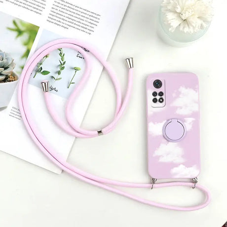 a pink phone case with a white cloud pattern