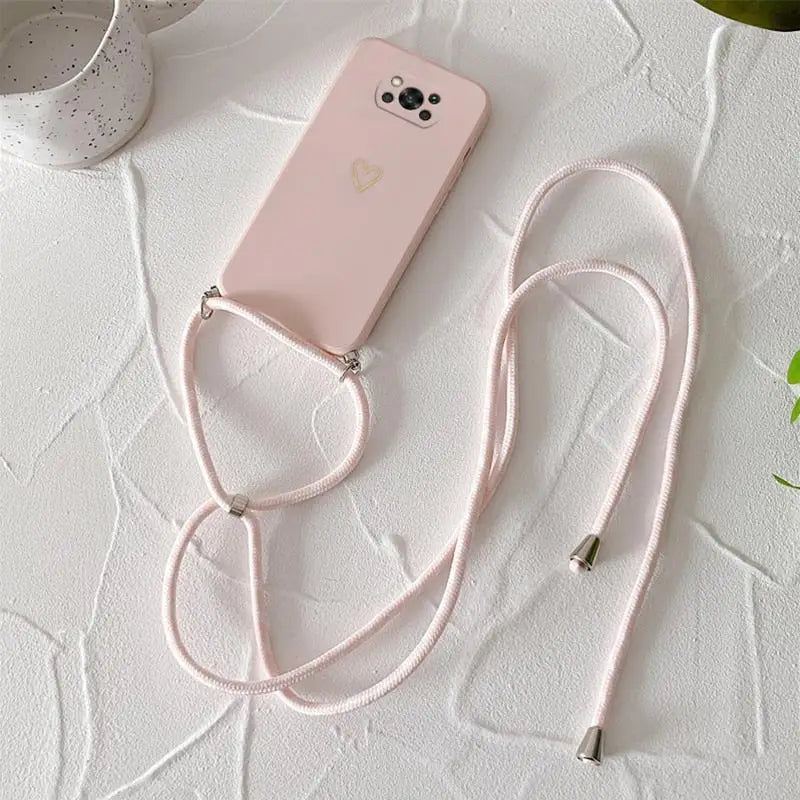 a pink phone case with a white strap