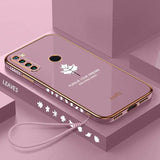 a pink phone case with a white maple leaf design