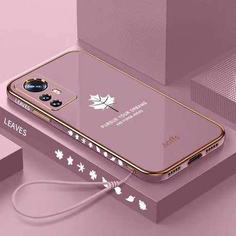 A pink phone case with a white maple leaf on it