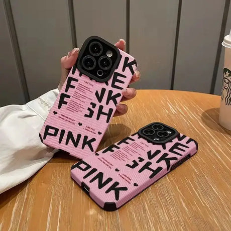 A pink phone case with the words’pink’on it