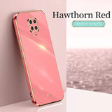 the back of a pink phone with a gold frame