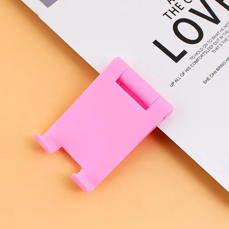 a pink paper clip with the word love on it