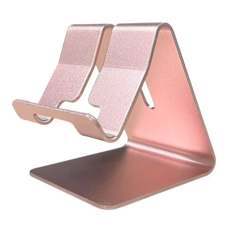 A pink phone stand with a phone on top