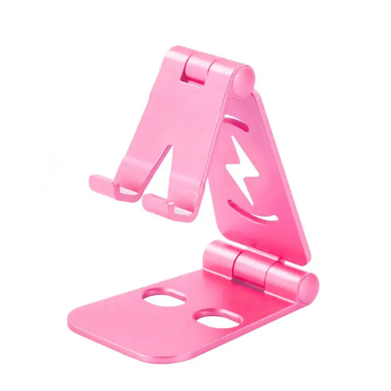 a pink phone stand with a white background