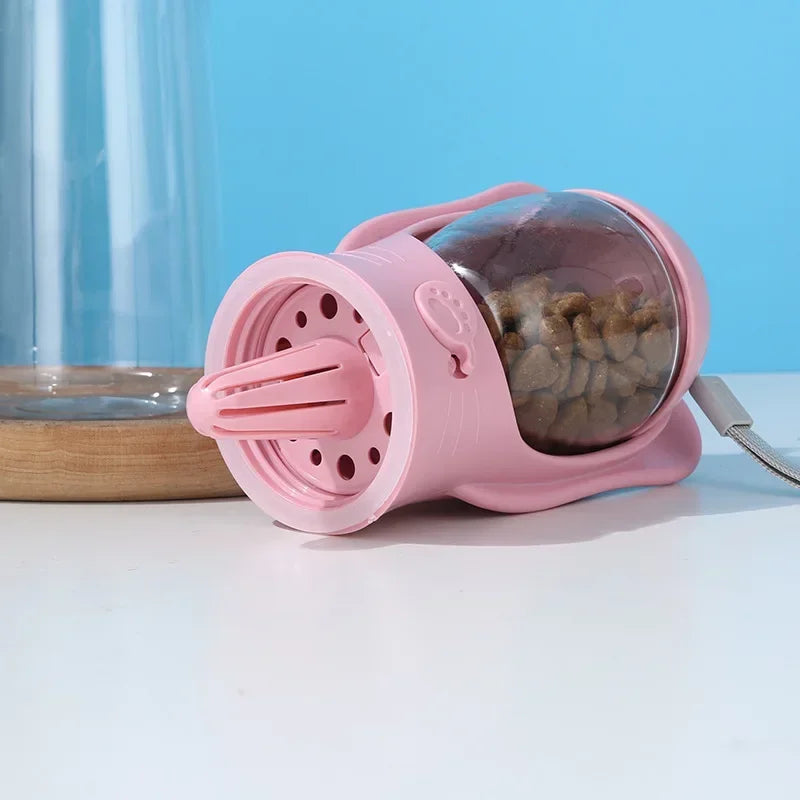 a pink plastic cup with a spoon and a small bowl of food