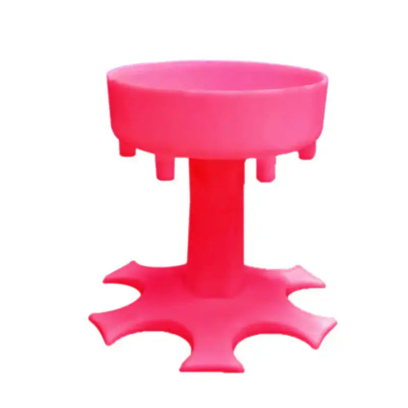 a pink plastic stool with a small hole