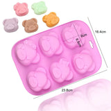 a pink plastic tray with six small plastic hearts