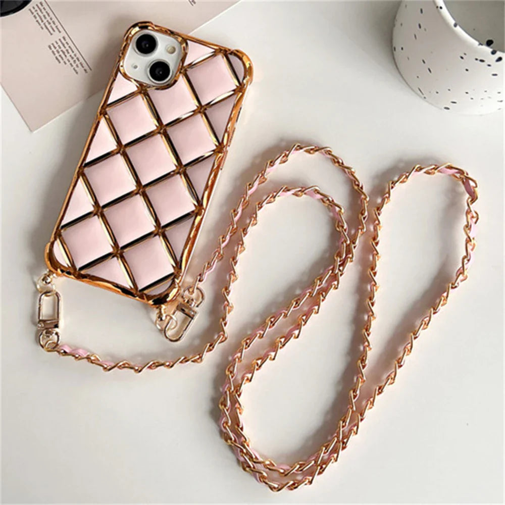 Pink quilted phone case with gold chain strap.