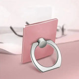 a pink phone holder with a ring on it
