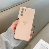 Pink smartphone case with a gold heart design