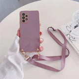 Pink smartphone with a matching detachable neck strap.