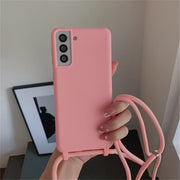 Pink smartphone with a matching lanyard case.