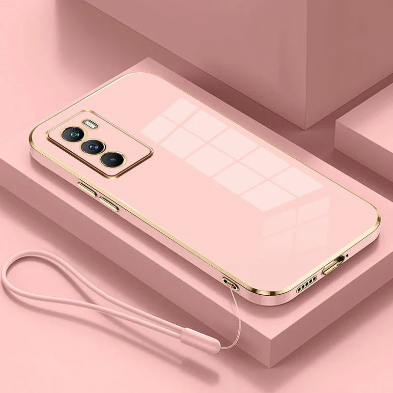 Pink smartphone with a triple camera setup and gold-colored edges.