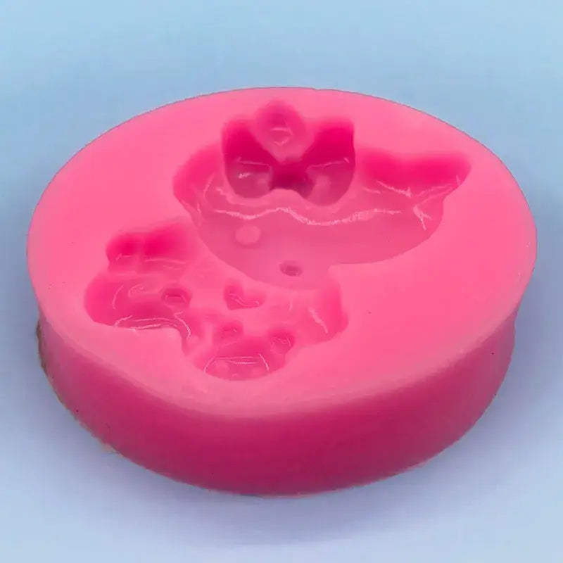 a pink soap with hearts on it