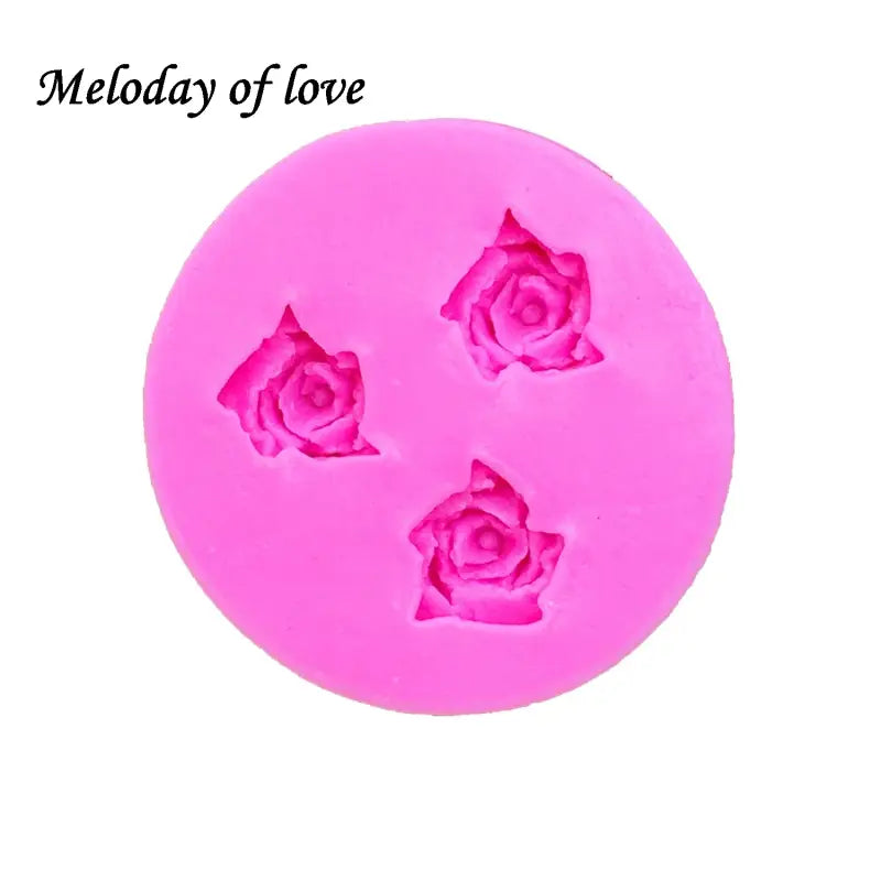 a pink soap with a rose shaped design on it