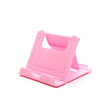 a pink plastic phone stand