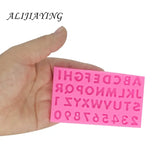 someone holding a pink sticker with a pink alphabet on it