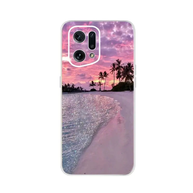 a pink sunset on the beach with palm trees and a pink sky