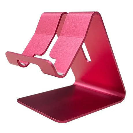 A pink tablet stand with a red surface