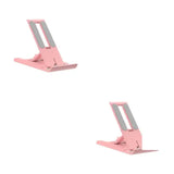 two pink metal stand for a laptop
