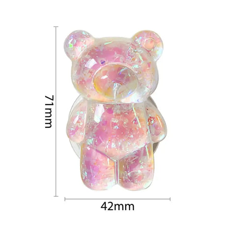 a pink teddy bear with a white background