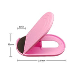a pink toilet brush with a black brush