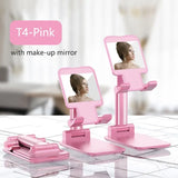 a pink vanity with a mirror and a woman’s face
