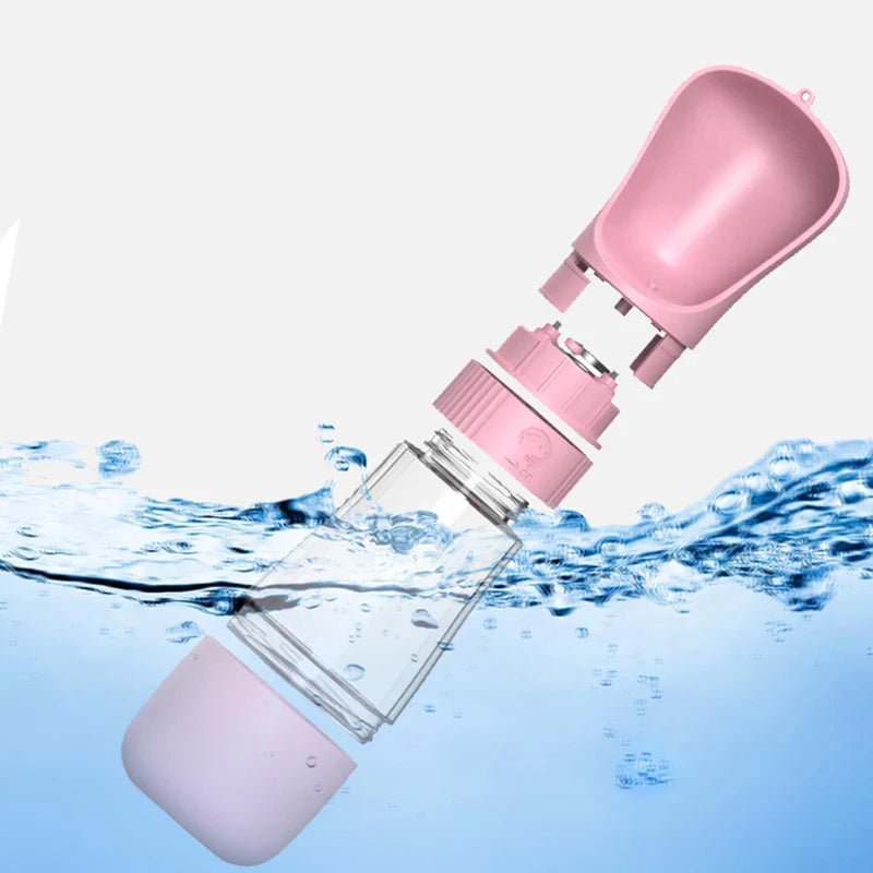 a pink water bottle floating in the water