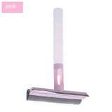 a pink brush with a white handle