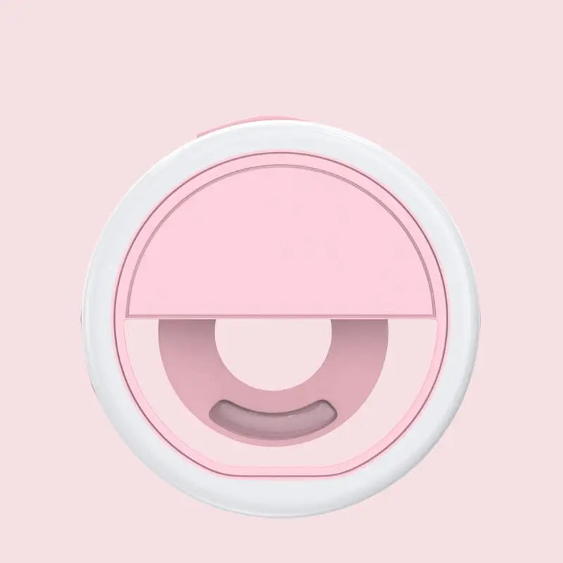 a pink and white circular object with a circular hole
