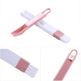 a pink and white plastic knife with a white handle