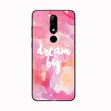 a pink and white phone case with the words dream big on it