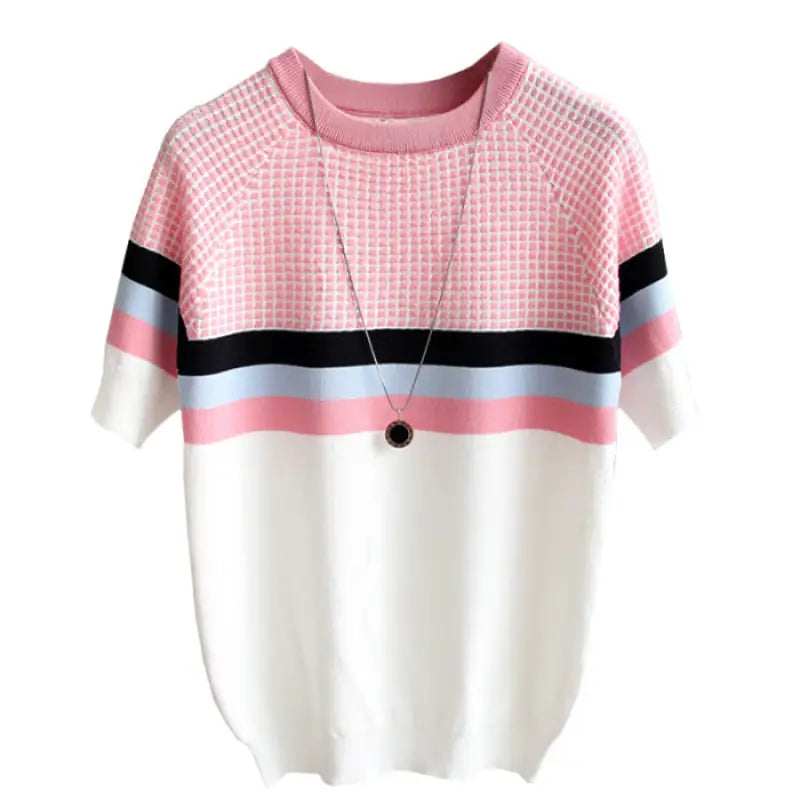 a pink and white sweater with a black and white checkered pattern