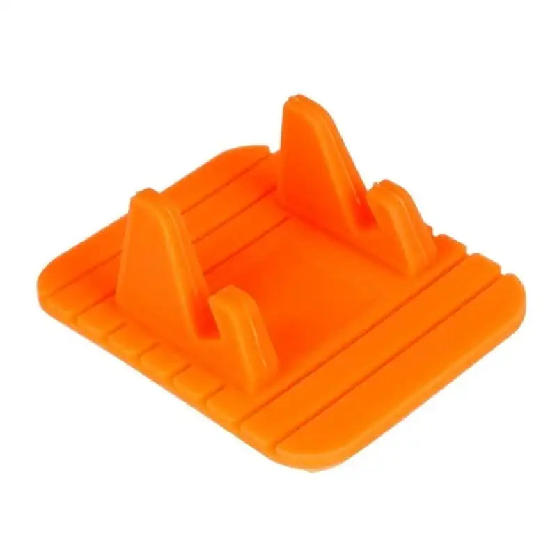 A plastic orange plastic clip holder