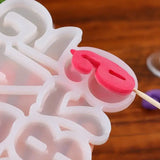 a plastic tray with a pink heart shaped ice tray