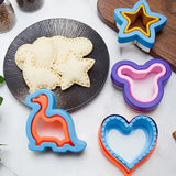 A plate with cookies and cookie cutters on it