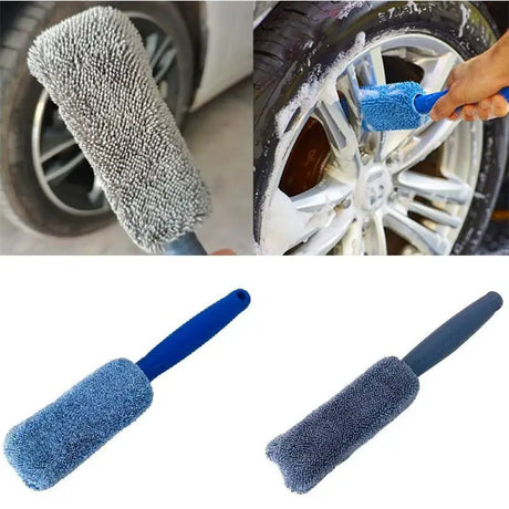 a close up of a person cleaning a car wheel with a blue brush