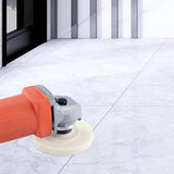 a person using a polisher to polish a tile